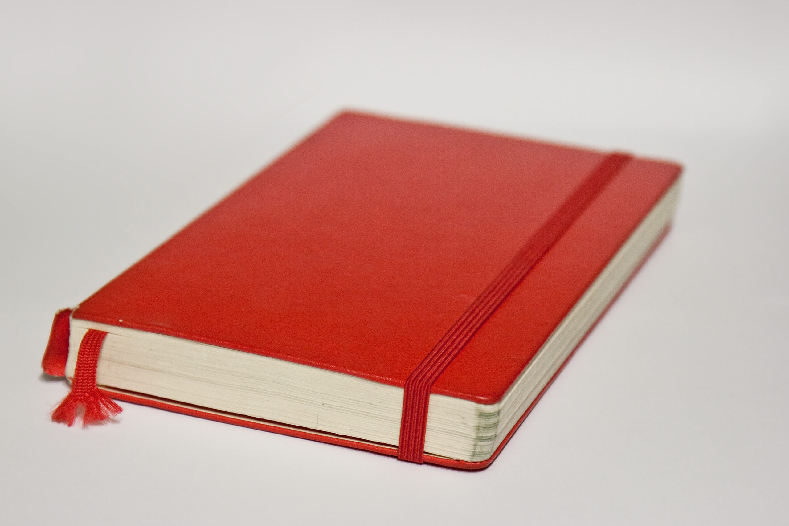 Red Moleskine hardcover notebook with an elastic closure